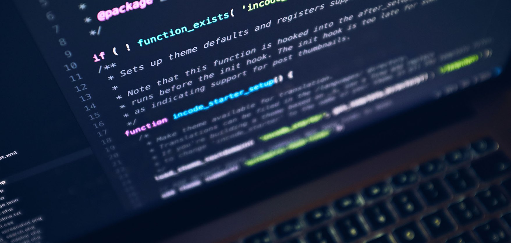 A laptop screen displaying code